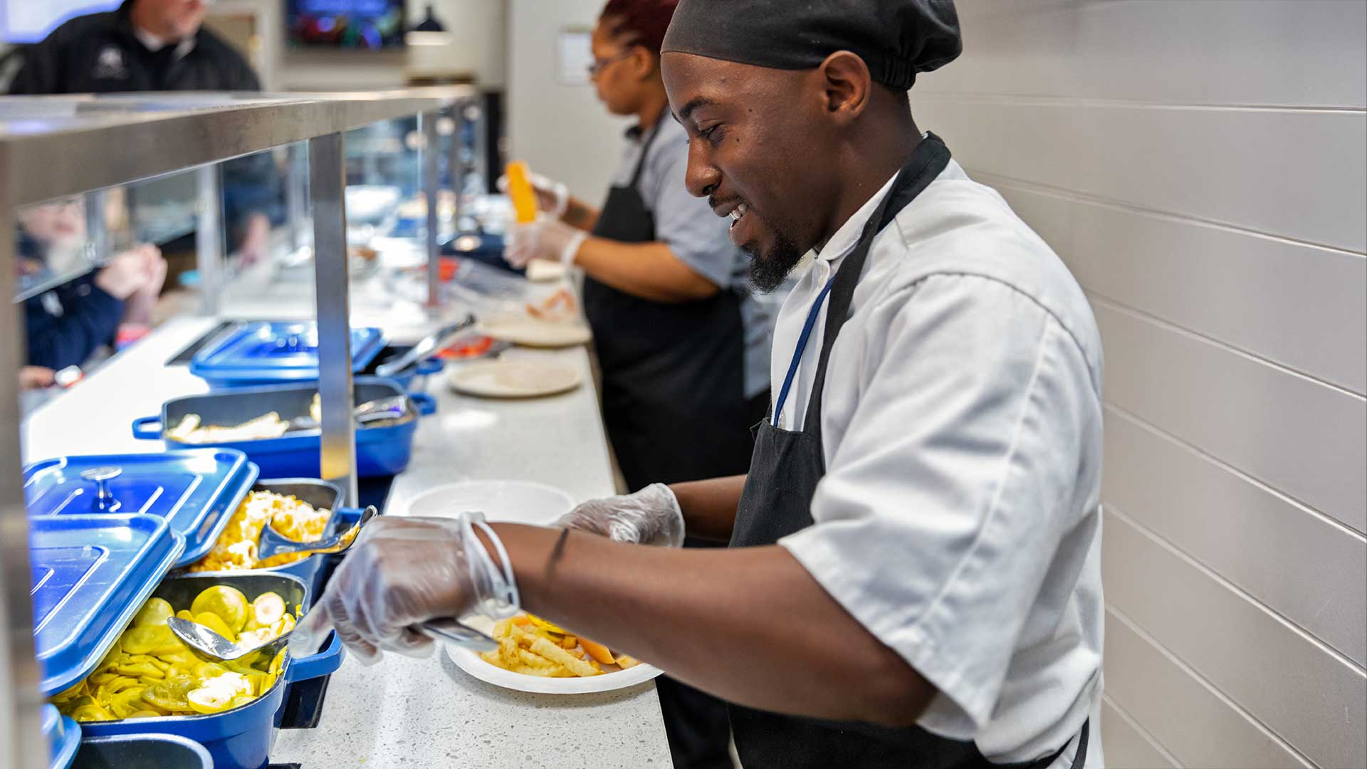 Cooking making a plate on serving line
